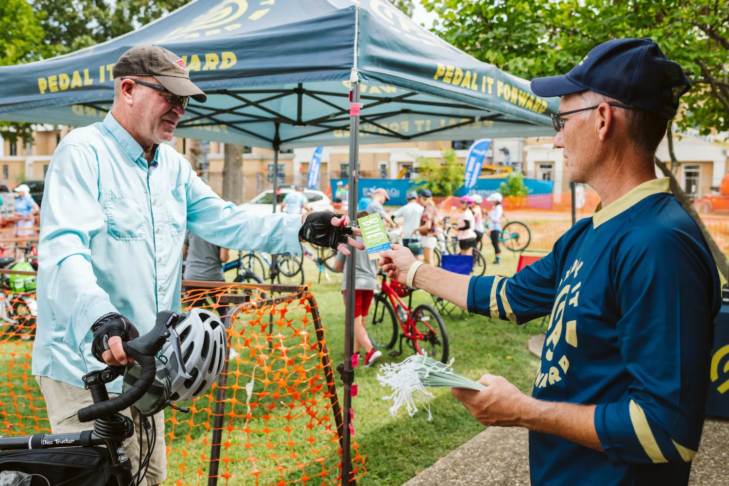 man checking in at Pedal It Forward bike valet